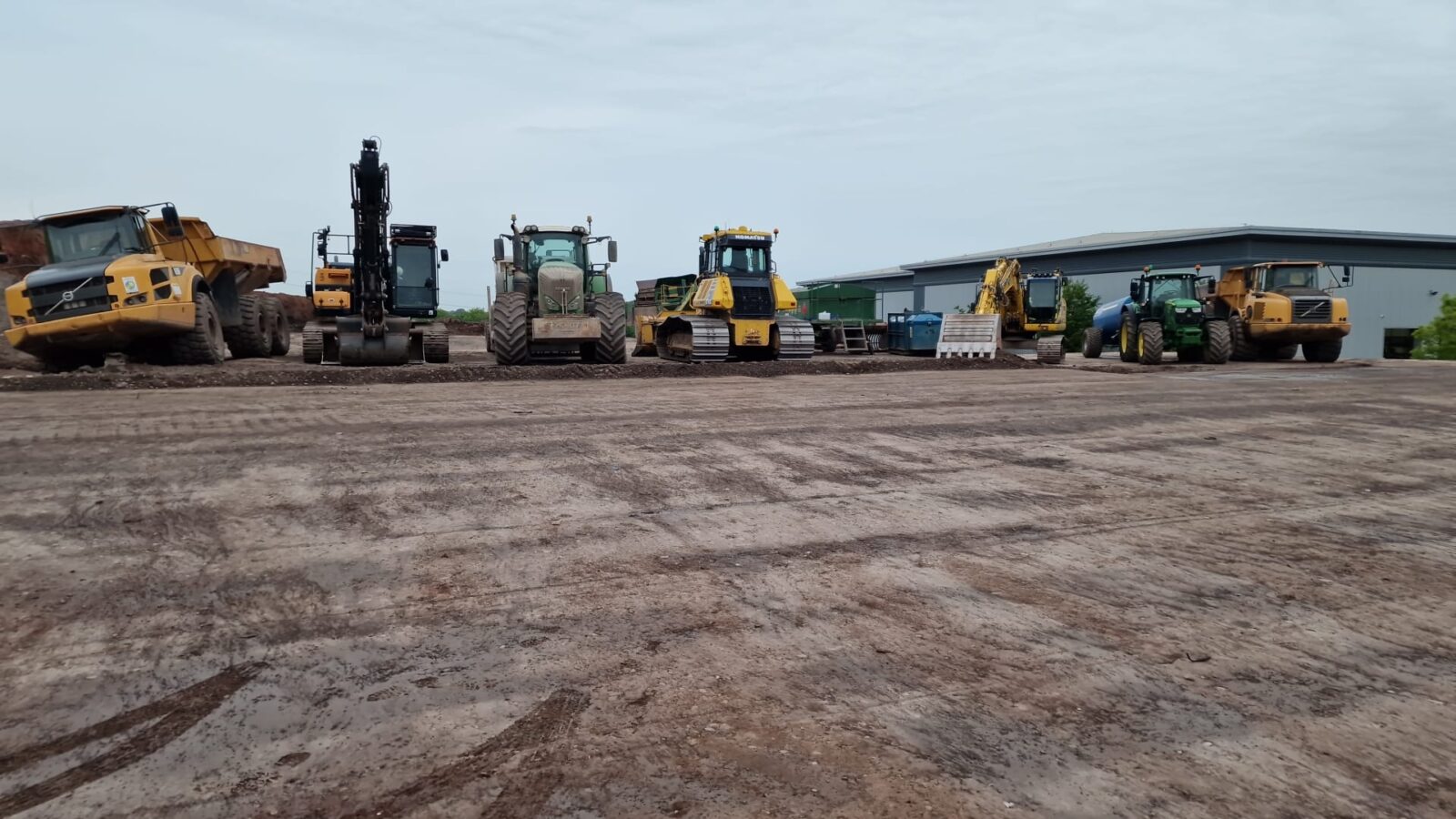Heavy plant lined up on an open construction site