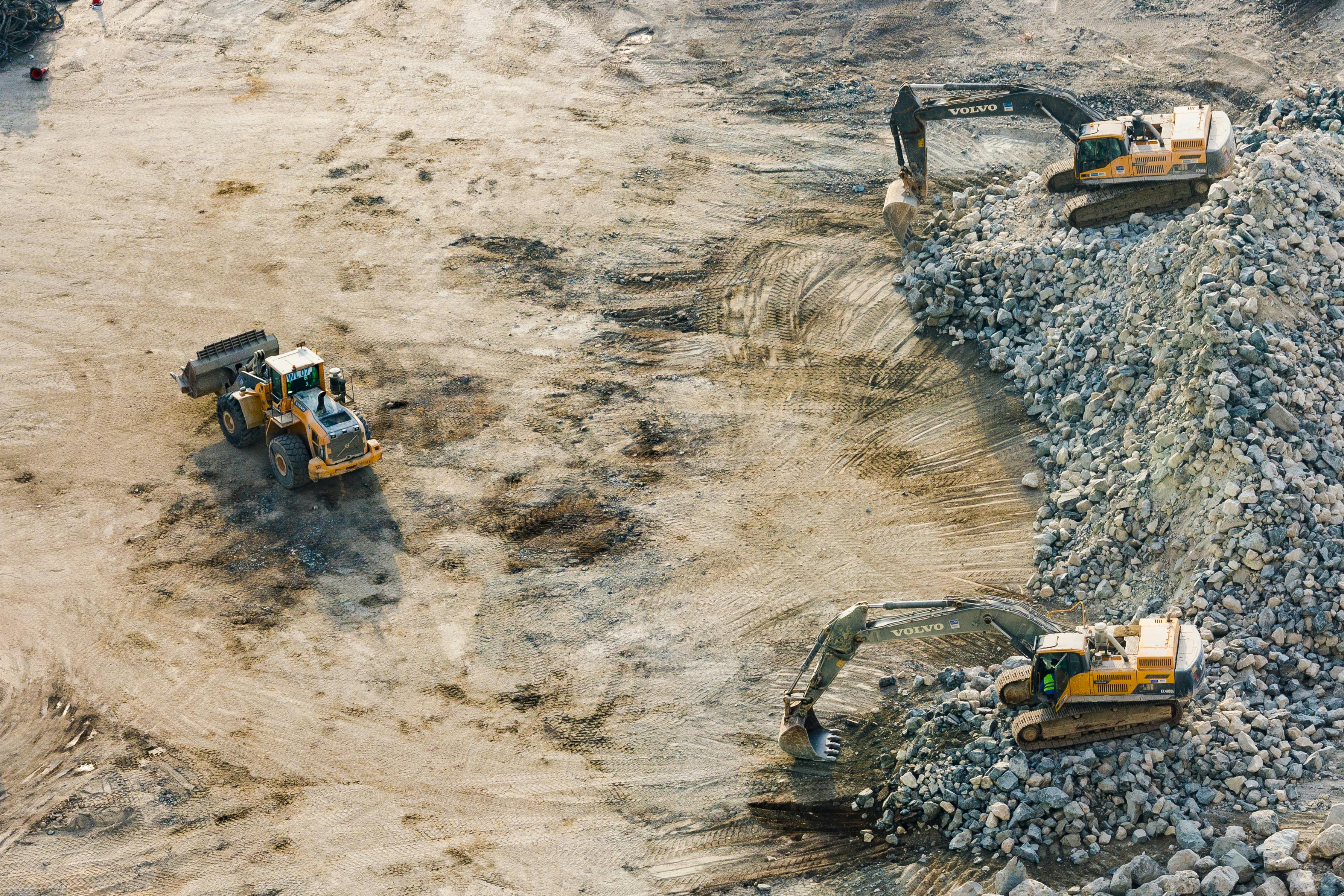 Excavators working on a quarry floor